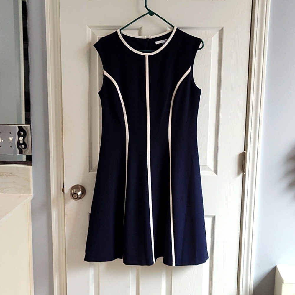 Navy blue dress with white piping on the front. From Studio One size 10.